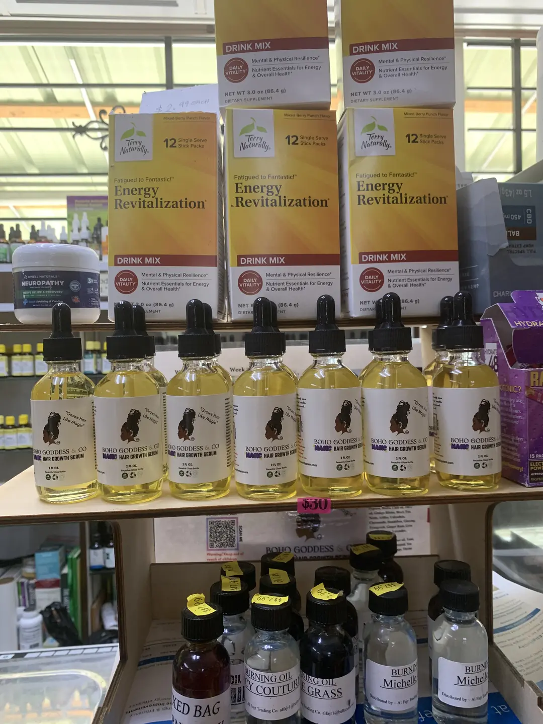 Bottles of MHG Serum displayed on a retail shelf